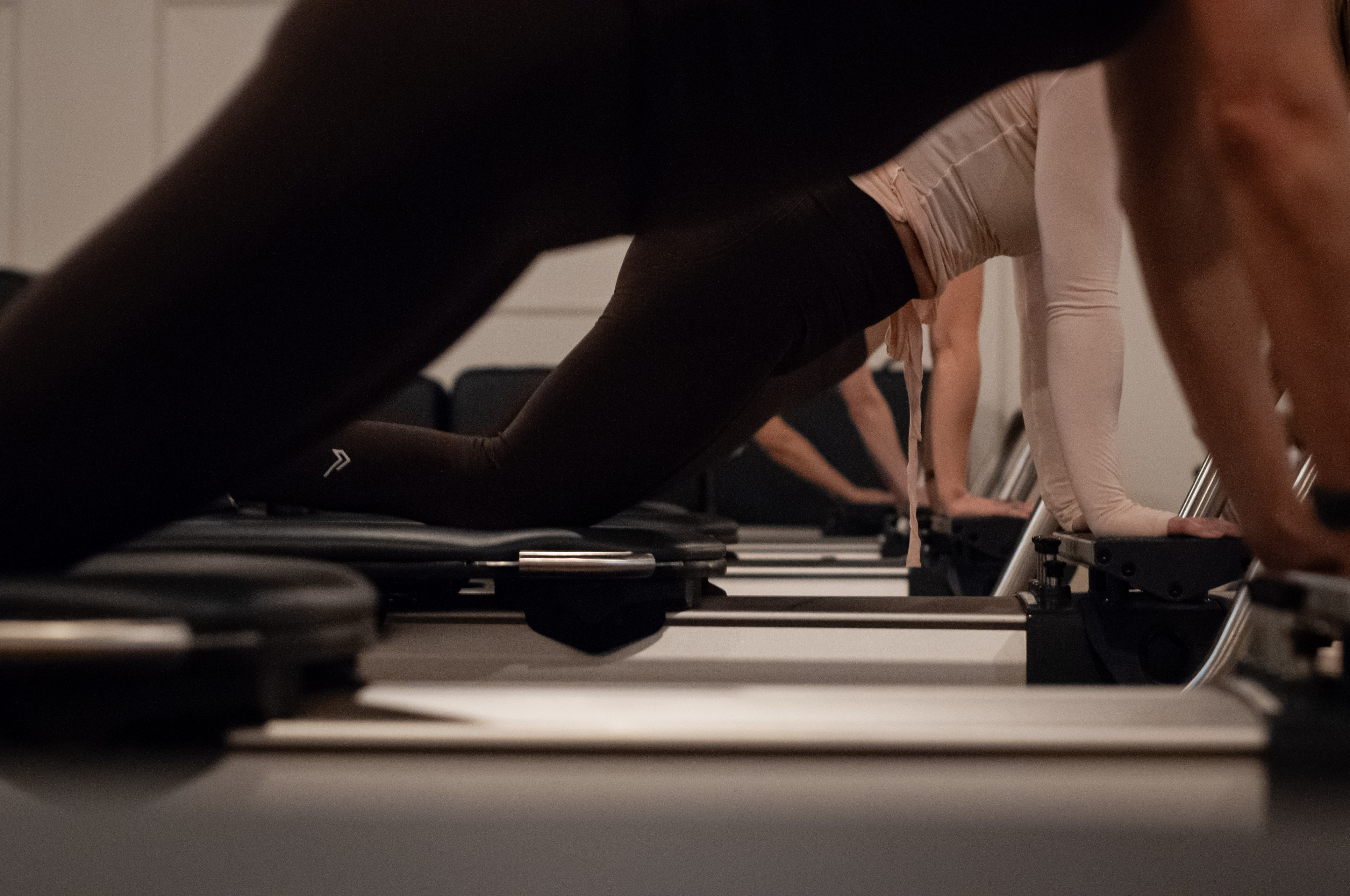 A low plank across the Reformer carriage